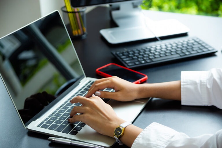 female-hand-typing-on-keyboard-of-laptop